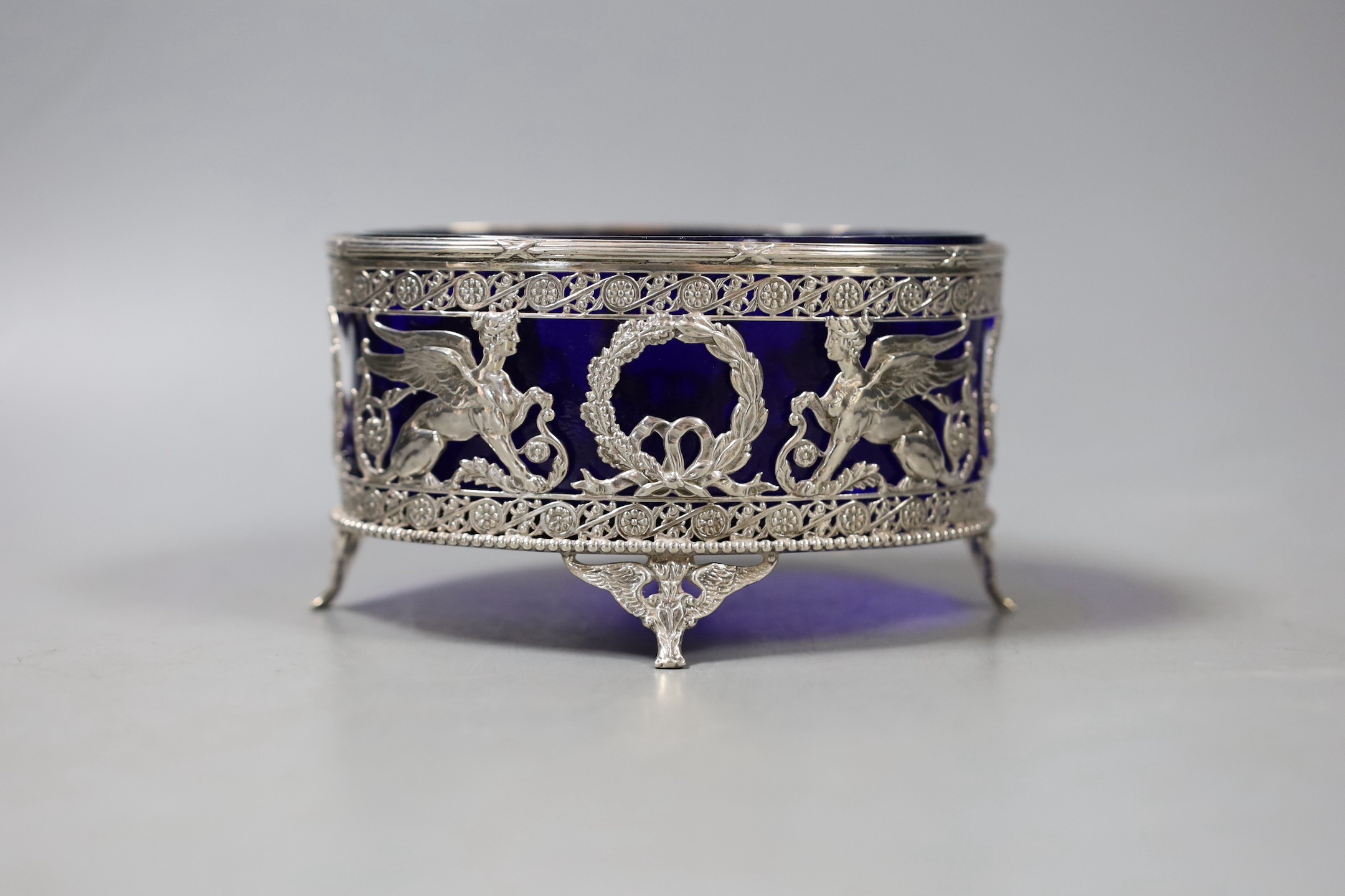 An early 20th century Hanau pierced silver oval bowl, with blue glass liner, import marks for London, 1906, 13.2cm.